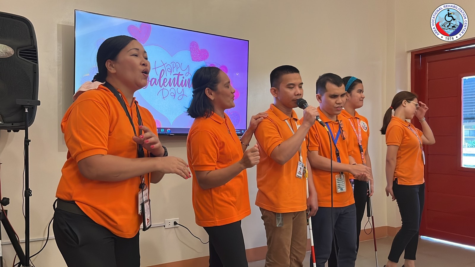 PWD clients serenade and dance with AVRC II staff with love songs.