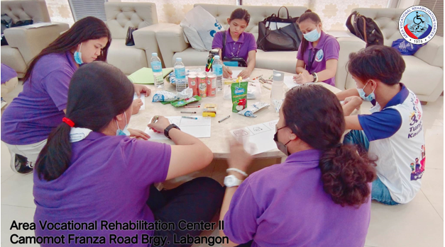 Deaf clients of the AVRC II doing their Vision Boards.